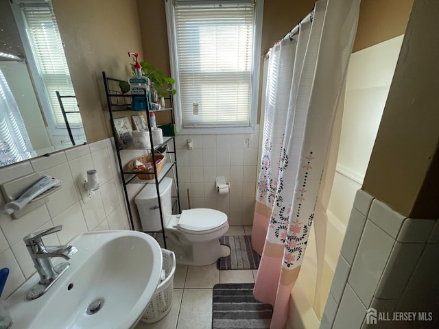 18 Bethany St, New Brunswick, NJ 08901 - full bathroom with a sink, tile walls, toilet, tile patterned floors, and a shower with curtain