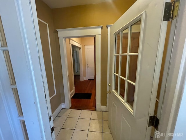 18 Bethany St, New Brunswick, NJ 08901 - hallway featuring light tile patterned floors and baseboards