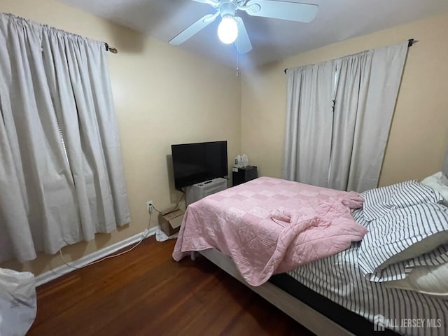 18 Bethany St, New Brunswick, NJ 08901 - bedroom featuring wood finished floors, a ceiling fan, and baseboards