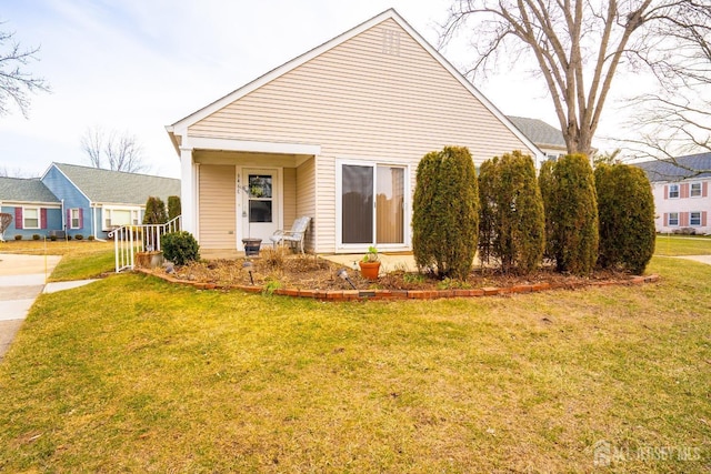 bungalow-style house featuring a front yard