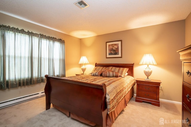 bedroom with a baseboard radiator, light colored carpet, and a textured ceiling