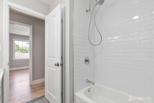 141 Day St, South Plainfield, NJ 07080 - full bath with washtub / shower combination, baseboards, and wood finished floors