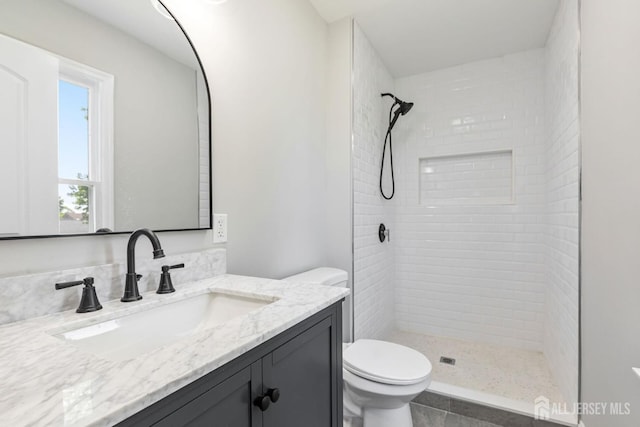 141 Day St, South Plainfield, NJ 07080 - bathroom with tiled shower, toilet, and vanity