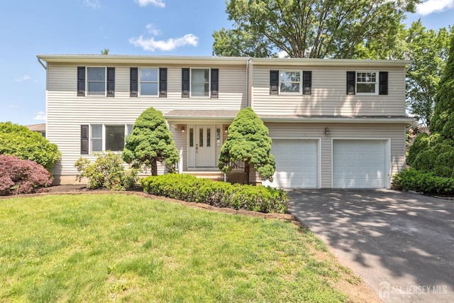 141 Day St, South Plainfield, NJ 07080 - view of front of home featuring a garage, driveway, and a front lawn