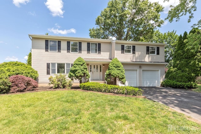 141 Day St, South Plainfield, NJ 07080 - view of front of home featuring a garage, asphalt driveway, and a front lawn