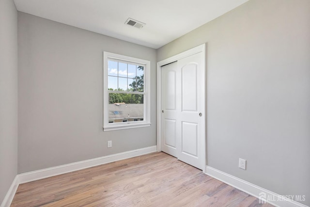 141 Day St, South Plainfield, NJ 07080 - unfurnished bedroom featuring light wood-style floors, baseboards, and a closet