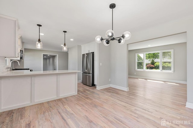 141 Day St, South Plainfield, NJ 07080 - kitchen featuring freestanding refrigerator, light countertops, baseboards, light wood-type flooring, and recessed lighting