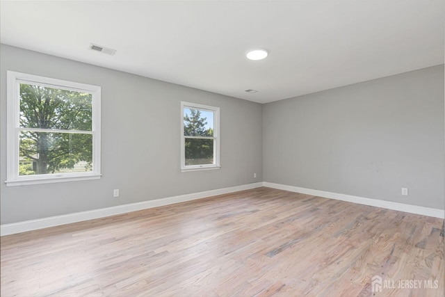 141 Day St, South Plainfield, NJ 07080 - spare room with light wood-type flooring and baseboards