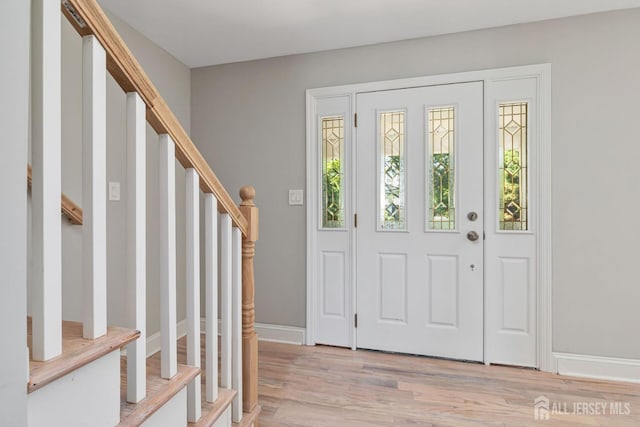 141 Day St, South Plainfield, NJ 07080 - entryway featuring stairs, light wood finished floors, and baseboards