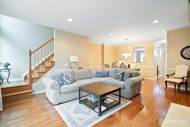 4 Sandra Ct Unit 2743, Old Bridge, NJ 08857 - living room with stairway, light wood-style floors, crown molding, a chandelier, and recessed lighting
