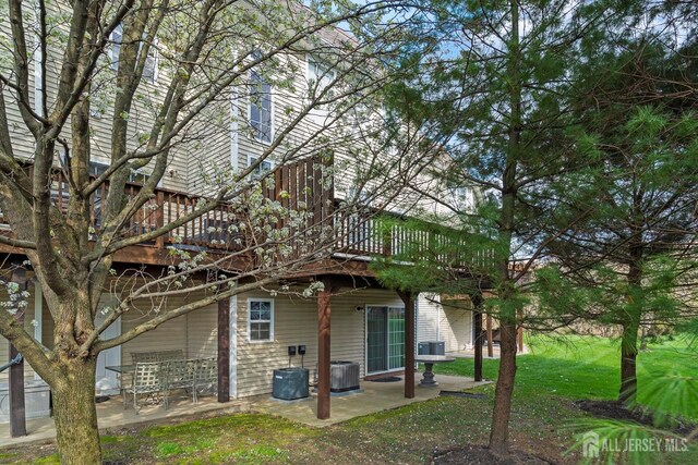 4 Sandra Ct Unit 2743, Old Bridge, NJ 08857 - rear view of property with a patio, a deck, central AC, and a lawn