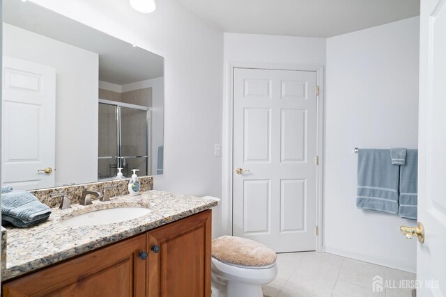 4 Sandra Ct Unit 2743, Old Bridge, NJ 08857 - full bath featuring vanity, a stall shower, tile patterned flooring, toilet, and baseboards