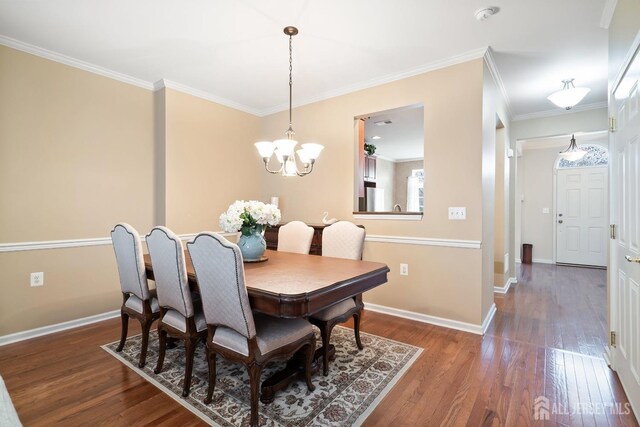 4 Sandra Ct Unit 2743, Old Bridge, NJ 08857 - dining space featuring wood finished floors, a chandelier, baseboards, and ornamental molding
