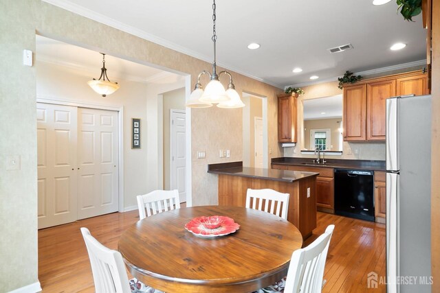4 Sandra Ct Unit 2743, Old Bridge, NJ 08857 - dining area featuring light wood-style floors, recessed lighting, crown molding, and baseboards