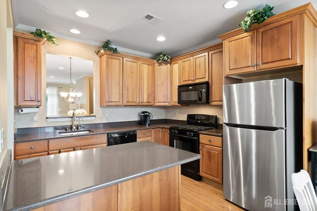 4 Sandra Ct Unit 2743, Old Bridge, NJ 08857 - kitchen featuring black appliances, a sink, crown molding, a chandelier, and recessed lighting