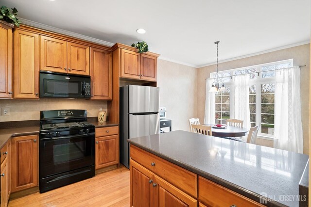 4 Sandra Ct Unit 2743, Old Bridge, NJ 08857 - kitchen with black appliances, dark countertops, ornamental molding, brown cabinetry, and light wood-style floors