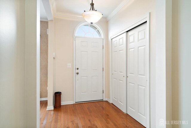 4 Sandra Ct Unit 2743, Old Bridge, NJ 08857 - entrance foyer with crown molding, light wood-style flooring, and baseboards