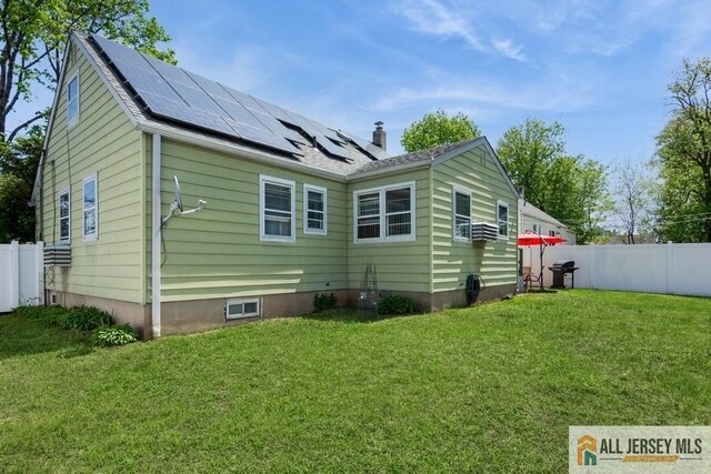 1 Berkley Blvd, Iselin, NJ 08830 - back of house with solar panels and a chimney