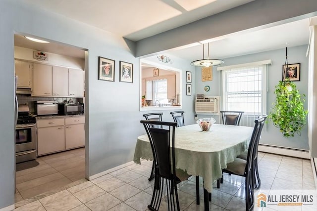 1 Berkley Blvd, Iselin, NJ 08830 - dining space featuring a baseboard heating unit, light tile patterned floors, and a wall mounted air conditioner