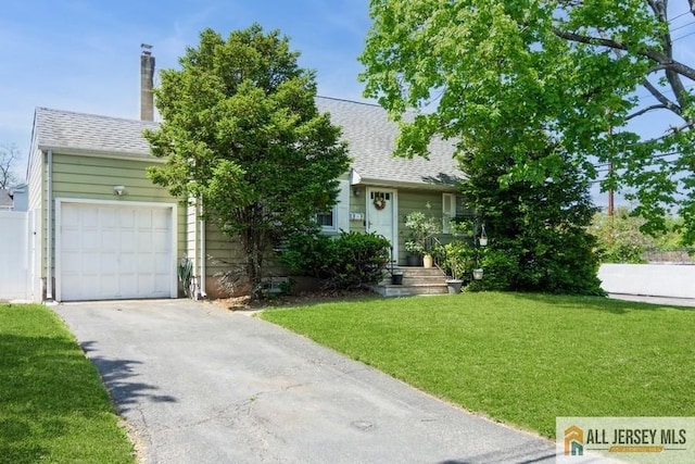 1 Berkley Blvd, Iselin, NJ 08830 - view of front facade with asphalt driveway, a front yard, a garage, and a shingled roof