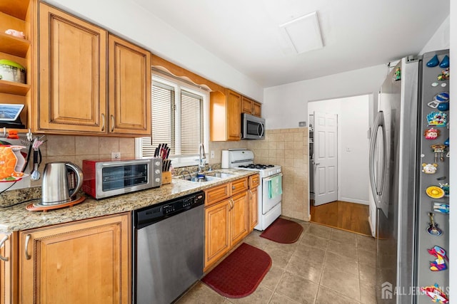 66 Riverbend Dr, North Brunswick, NJ 08902 - kitchen featuring appliances with stainless steel finishes, light tile patterned flooring, tasteful backsplash, open shelves, and light stone countertops