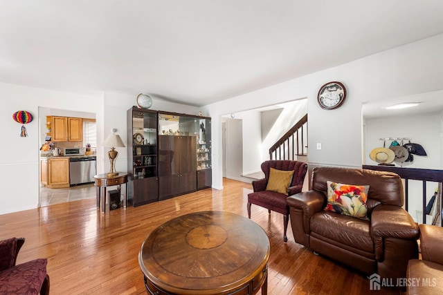 66 Riverbend Dr, North Brunswick, NJ 08902 - living area featuring light wood finished floors and stairs