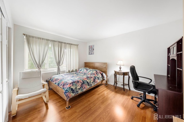 66 Riverbend Dr, North Brunswick, NJ 08902 - bedroom with wood finished floors and a desk