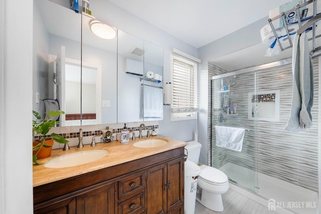 66 Riverbend Dr, North Brunswick, NJ 08902 - full bathroom featuring double vanity, a stall shower, and decorative backsplash