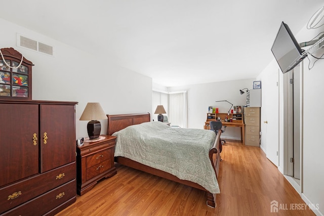 66 Riverbend Dr, North Brunswick, NJ 08902 - bedroom featuring light wood-style flooring and a desk