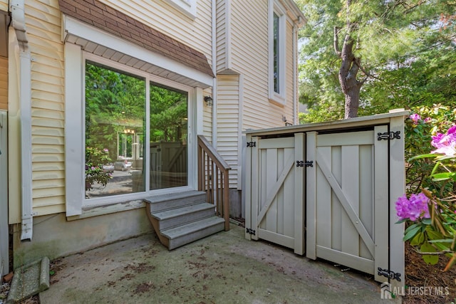 1018 Schmidt Ln, North Brunswick, NJ 08902 - view of side of property with entry steps and a patio area