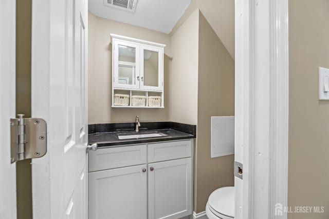 1018 Schmidt Ln, North Brunswick, NJ 08902 - bathroom with vanity, toilet, and baseboards