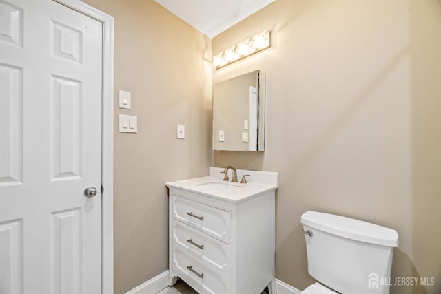 1018 Schmidt Ln, North Brunswick, NJ 08902 - half bathroom with baseboards, vanity, and toilet