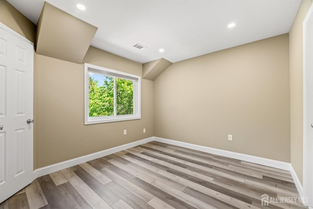 1018 Schmidt Ln, North Brunswick, NJ 08902 - unfurnished bedroom with baseboards, wood finished floors, and recessed lighting