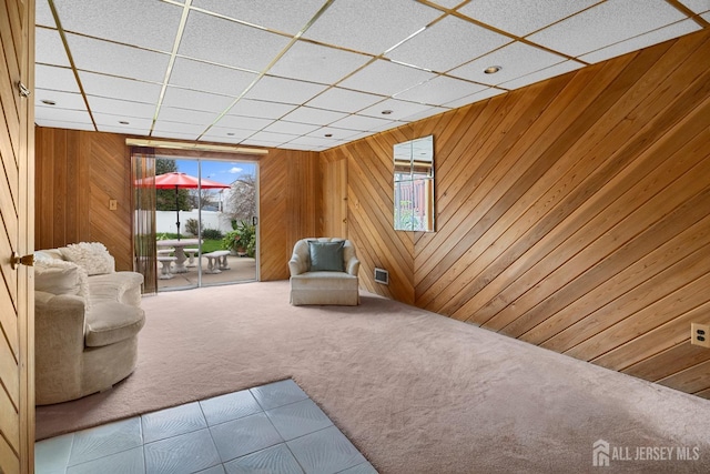 3 Hansen Rd, Old Bridge, NJ 08857 - living area with plenty of natural light, carpet floors, wood walls, and a drop ceiling