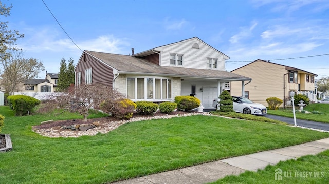 3 Hansen Rd, Old Bridge, NJ 08857 - view of front facade featuring driveway, a front lawn, and stone siding