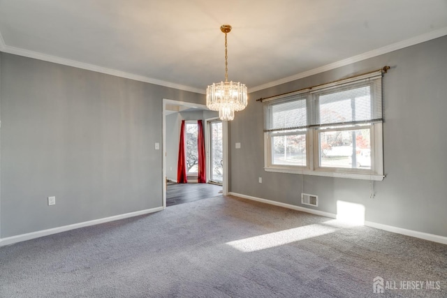 empty room featuring visible vents, baseboards, carpet, and crown molding