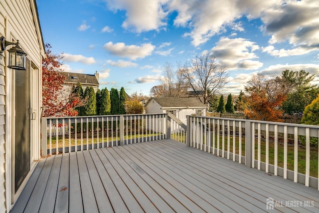 deck featuring an outbuilding