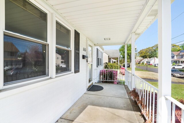 view of patio / terrace featuring a porch and a residential view
