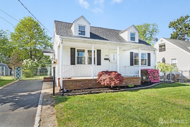 553 Harrison Ave, South Plainfield, NJ 07080 - new england style home featuring covered porch, a shingled roof, driveway, a gate, and a storage shed