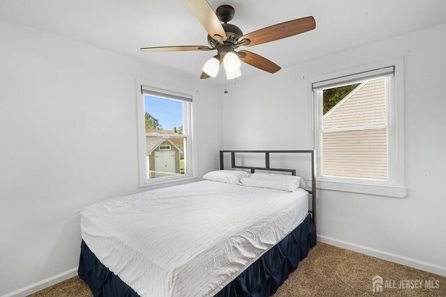bedroom featuring baseboards, carpet, and ceiling fan