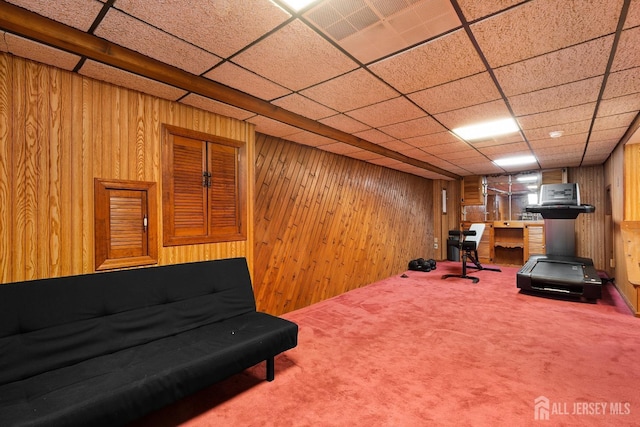 553 Harrison Ave, South Plainfield, NJ 07080 - living area featuring wood walls, carpet, and a paneled ceiling