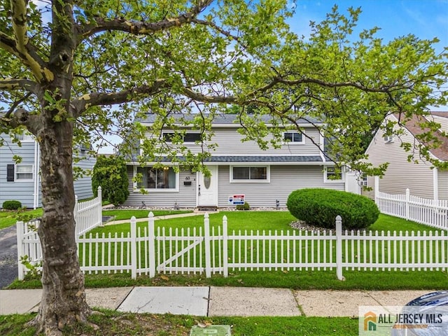 60 Sycamore St, Carteret, NJ 07008 - traditional home with a fenced front yard