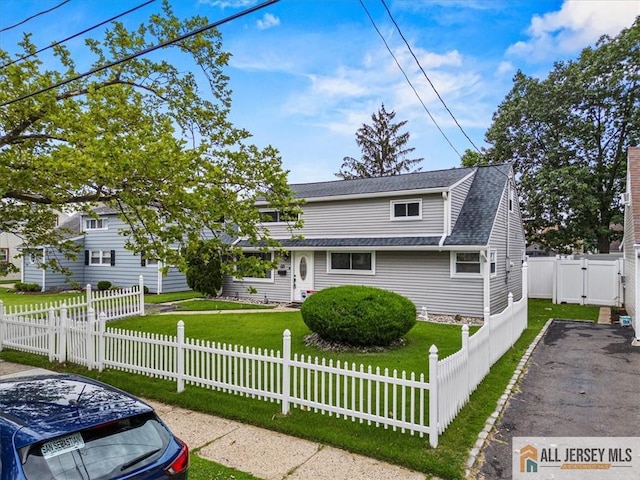60 Sycamore St, Carteret, NJ 07008 - traditional-style home with roof with shingles, a gate, and a fenced front yard