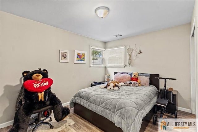 60 Sycamore St, Carteret, NJ 07008 - bedroom featuring baseboards and wood finished floors