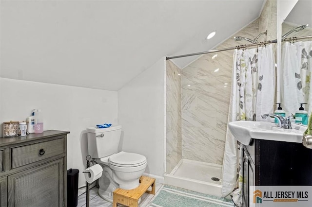 60 Sycamore St, Carteret, NJ 07008 - bathroom featuring vaulted ceiling, vanity, and tiled shower