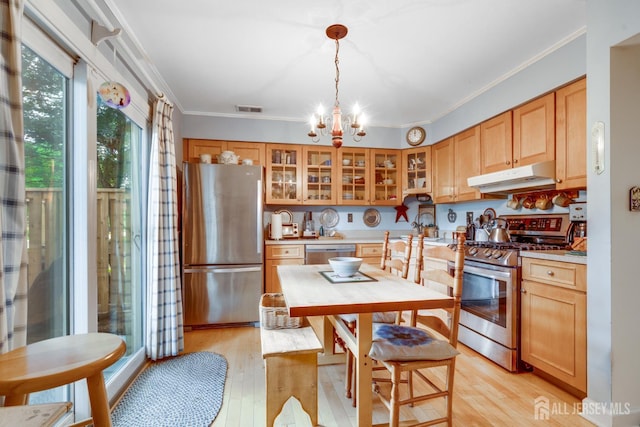 43 Nottingham Way, Franklin, NJ 08873 - kitchen with stainless steel appliances, light wood-style flooring, crown molding, a chandelier, and light countertops