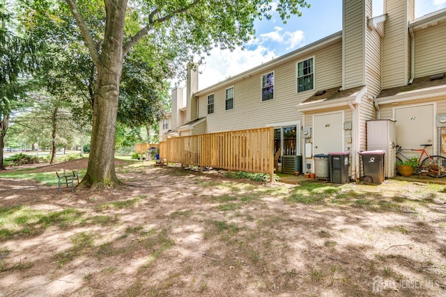 43 Nottingham Way, Franklin, NJ 08873 - rear view of property with a chimney