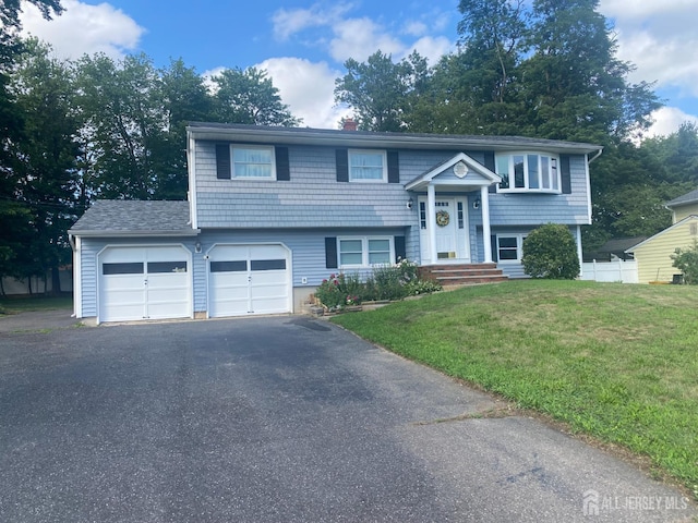 1461 Fela Ave, North Brunswick, NJ 08902 - bi-level home featuring asphalt driveway and a chimney