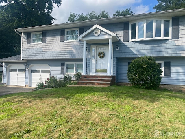 1461 Fela Ave, North Brunswick, NJ 08902 - split foyer home with driveway, a garage, and a front yard