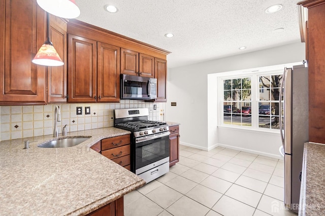 18 Albury Way N, Brunswick, NJ 08902 - kitchen featuring stainless steel appliances, a sink, decorative backsplash, baseboards, and brown cabinetry